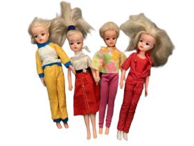 Four Sindy dolls all 033055x, three of which also marked Sindy. Plus a quantity of clothing includin