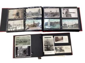 Postcards in two albums including London, shipping, views, French cards etc.