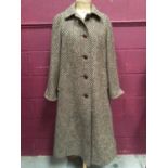 Aquascutum women's wool tweed overcoat with attached scarf.