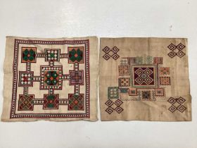 A selection of vintage textiles including an East European patchwork cover with geometric cross stit