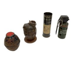 Mills bomb grenade converted into a desk weight together with dummy / training grenades and a rubber