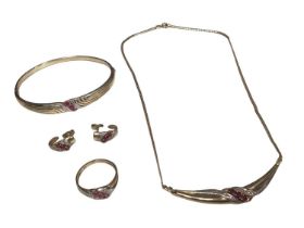 Ruby and diamond suite of jewellery in 9ct gold setting to include a necklace, bangle, ring and earr