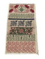 Late 19th century/early 20th century embroidered band sampler in polychrome cross stitch.