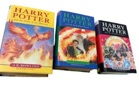 Three First Edition Harry Potter books to include the Half-Blood Prince with rare page 99 printing e