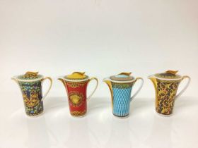 Group of four Versace porcelain jugs and covers, and two Portuguese inkwells