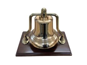 Large 20th century brass fire engine bell, mounted on wooden plinth, approx 31cm in height.