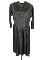 1950s black cocktail dress (label cut), Frank Usher black evening dress with looped underskirt plus