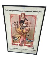 Bruce Lee's "Enter The Dragon" movie poster in glazed frame