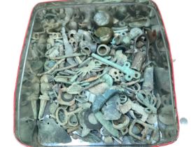 Tin containing metal detecting finds including a seal stamp