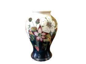 Moorcroft pottery Trial vase decorated with flowers, dated 16/3/10, 16cm high