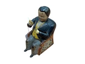 Late 19th century American cast iron Tammany mechanical money bank, in the form of a well-dressed se