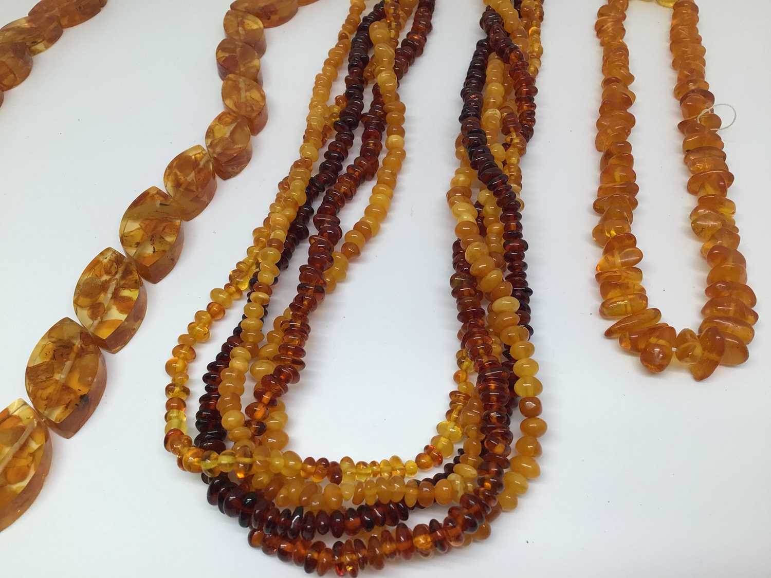 Amber bead torsade necklace with silver clasp, 48.5cm long and two other reconstituted amber bead ne - Image 2 of 2