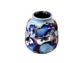 Moorcroft pottery vase decorated with Owls on blue ground, dated 2010, 8cm high