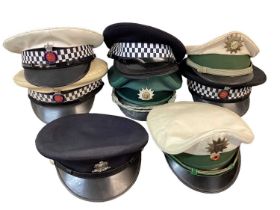 Collection of Police hats, helmets and head gear to include Essex Police motorcycle helmet, (1 box).