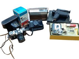Box of cameras and accessories, including Zenit, Canon, etc
