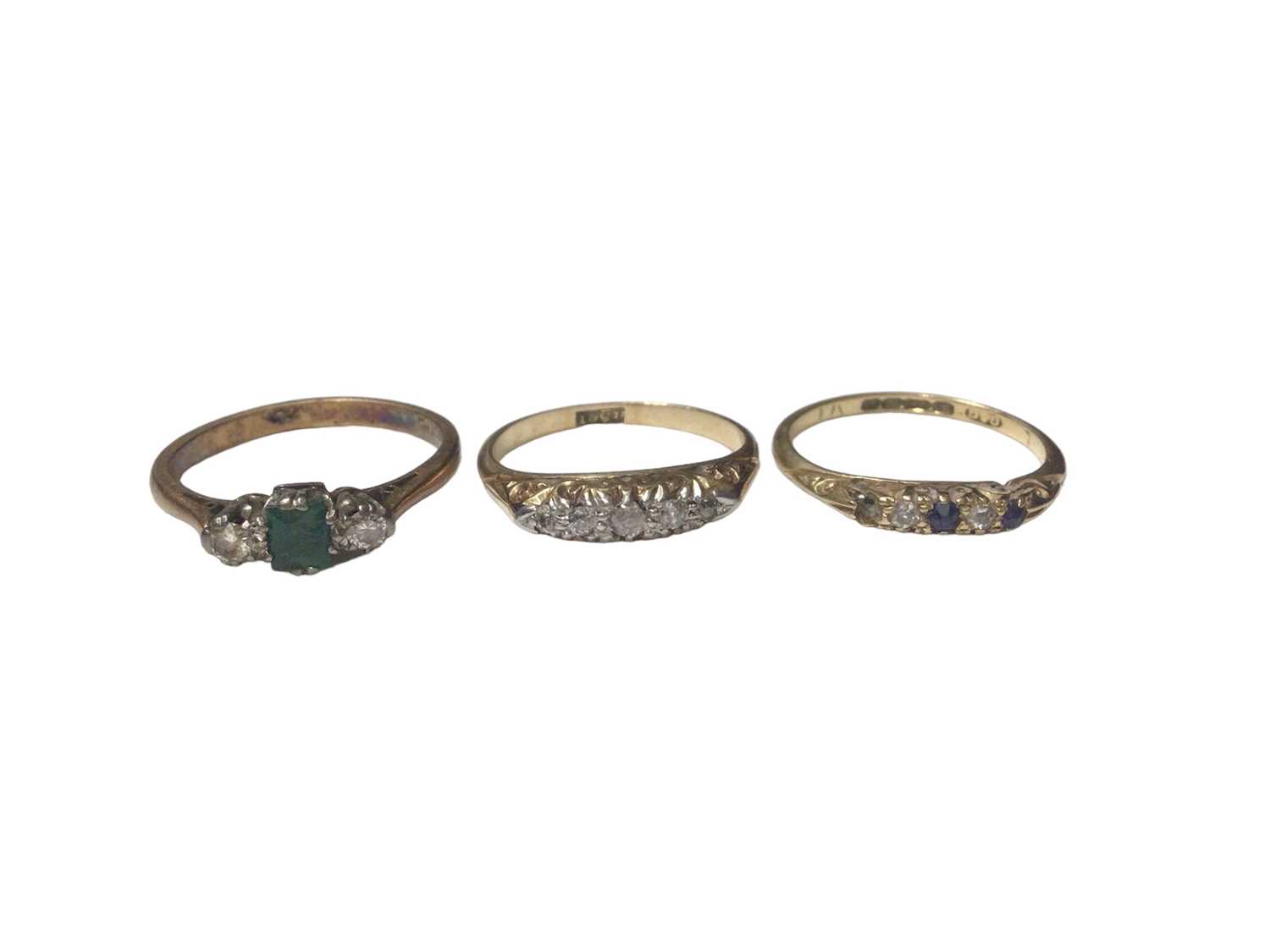 18ct gold diamond and emerald three stone ring, 18ct gold diamond five stone ring and 18ct gold sapp