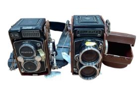 Two twin lens reflex cameras