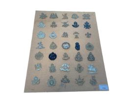 Group of Thirty Five First World War, Second World War and later British military cap badges to incl