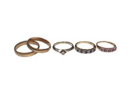 Five 9ct gold rings to include a diamond single stone ring, a sapphire and diamond eternity ring, a