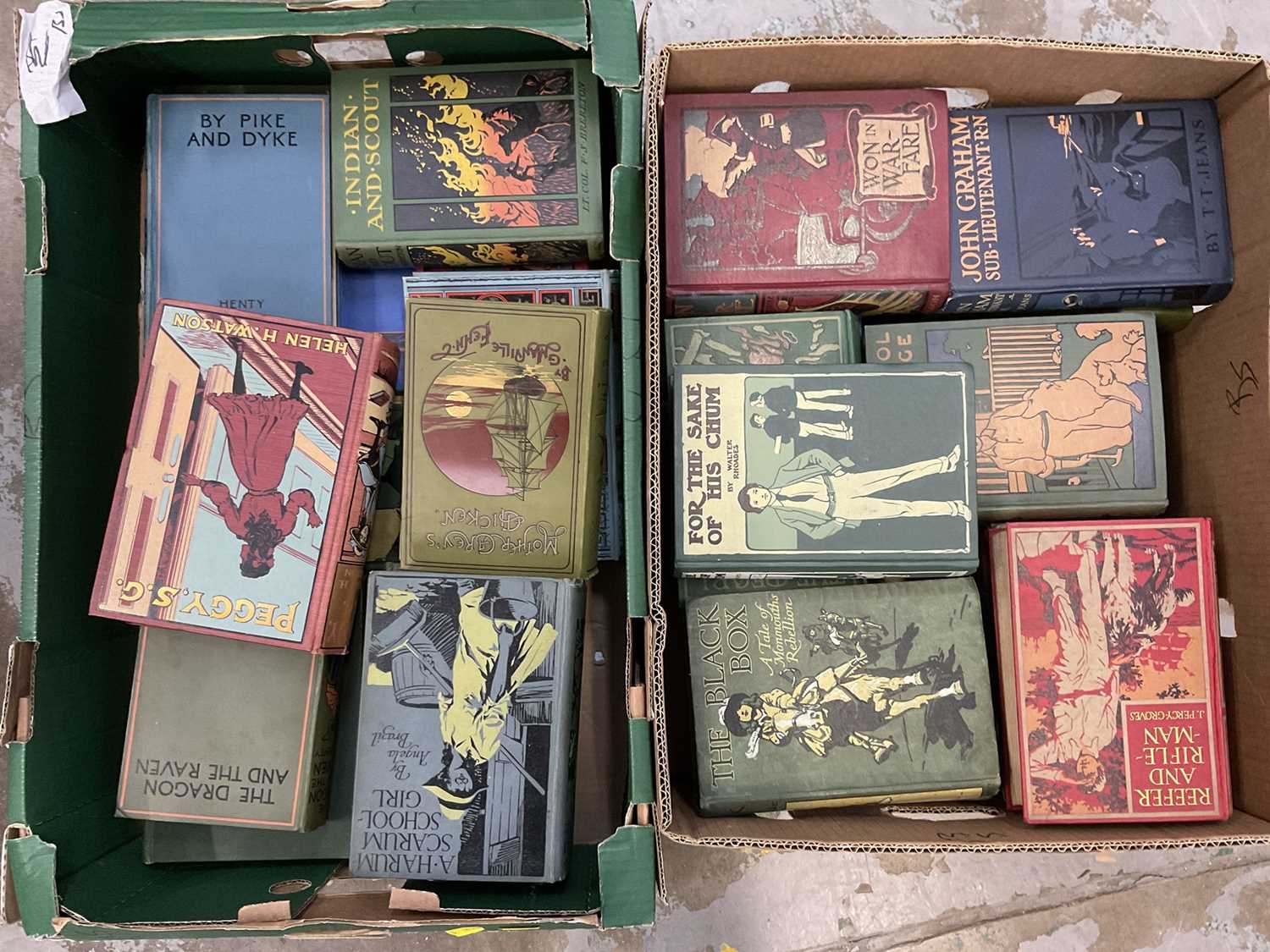 Two boxes of early 20th century decorative cloth bindings