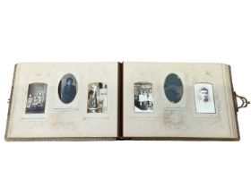 Three embossed Victorian photograph albums containing family and other carte de visite cards and pho