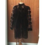 Good quality beaver lamb coat by Sprung Freres, Paris and a Saga Mink jacket.