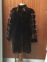 Good quality beaver lamb coat by Sprung Freres, Paris and a Saga Mink jacket.