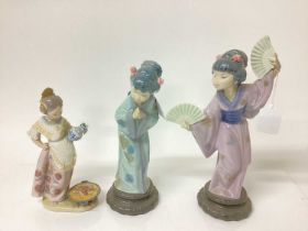 Two Lladro porcelain figures of geisha girls, tallest is 30.5cm high, together with another Lladro f