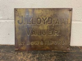 Cast brass sign - 'J. Lloyds, A.A.I. Valuer at Bow & Ilford', 30.5cm x 23cm