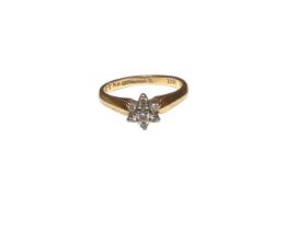 Diamond cluster ring with a flower head cluster of seven brilliant cut diamonds in 18ct gold setting