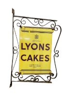 Original Lyons Cakes enamel sign mounted in wrought iron bracket, the sign 54.5cm x 36.5cm