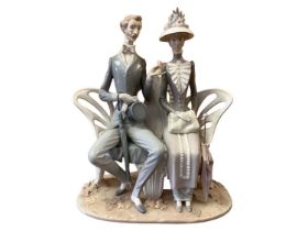 Lladro porcelain figure group - lovers on a bench, 30cm high