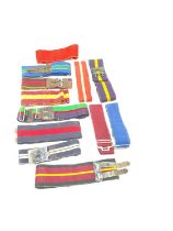 Collection of British military stable belts to include Royal Logistics Corps and The King's Own Bord