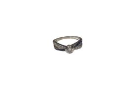Diamond single stone ring with sapphire and diamond set cross over shoulders