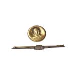 Yellow and white metal bar brooch set with rose cut diamonds and a yellow metal disc 'Virgo Fidelis'