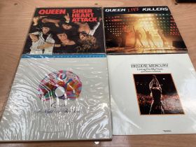 Vintage case of Queen LP's and 12 inch singles