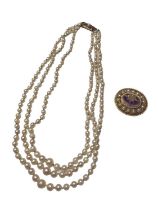 Cultured pearl three strand necklace with 9ct gold clasp and an antique style 9ct gold amethyst and