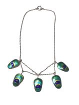 Art Nouveau style white metal and enamel necklace with five suspended pendants resembling peacock fe