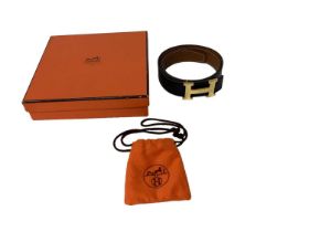 Hermès reversible Swift calfskin and Epsom calfskin leather belt, in black and brown, with a gilt me