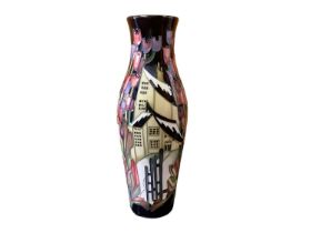 Moorcroft pottery vase decorated in the Flowers at Christmas pattern, signed, dated 2009, 25.5cm hig