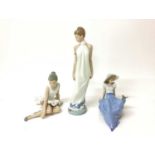 Six Nao porcelain figures including lady in white dress, 31cm high, ballerina, girl holding a pink f