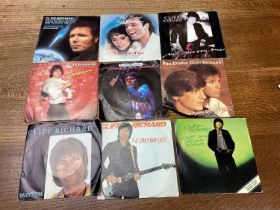 Box of single records including Capitols, Impressions, Isley Brothers, Bob Dylan, Crystals, Beatles,