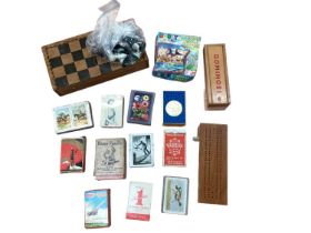 Lot of playing card sets, cribbage board, chess board and set, dominoes etc.