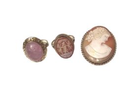 14ct gold rose quartz cabochon ring in a floral scroll engraved mount, together with a 9ct gold carv