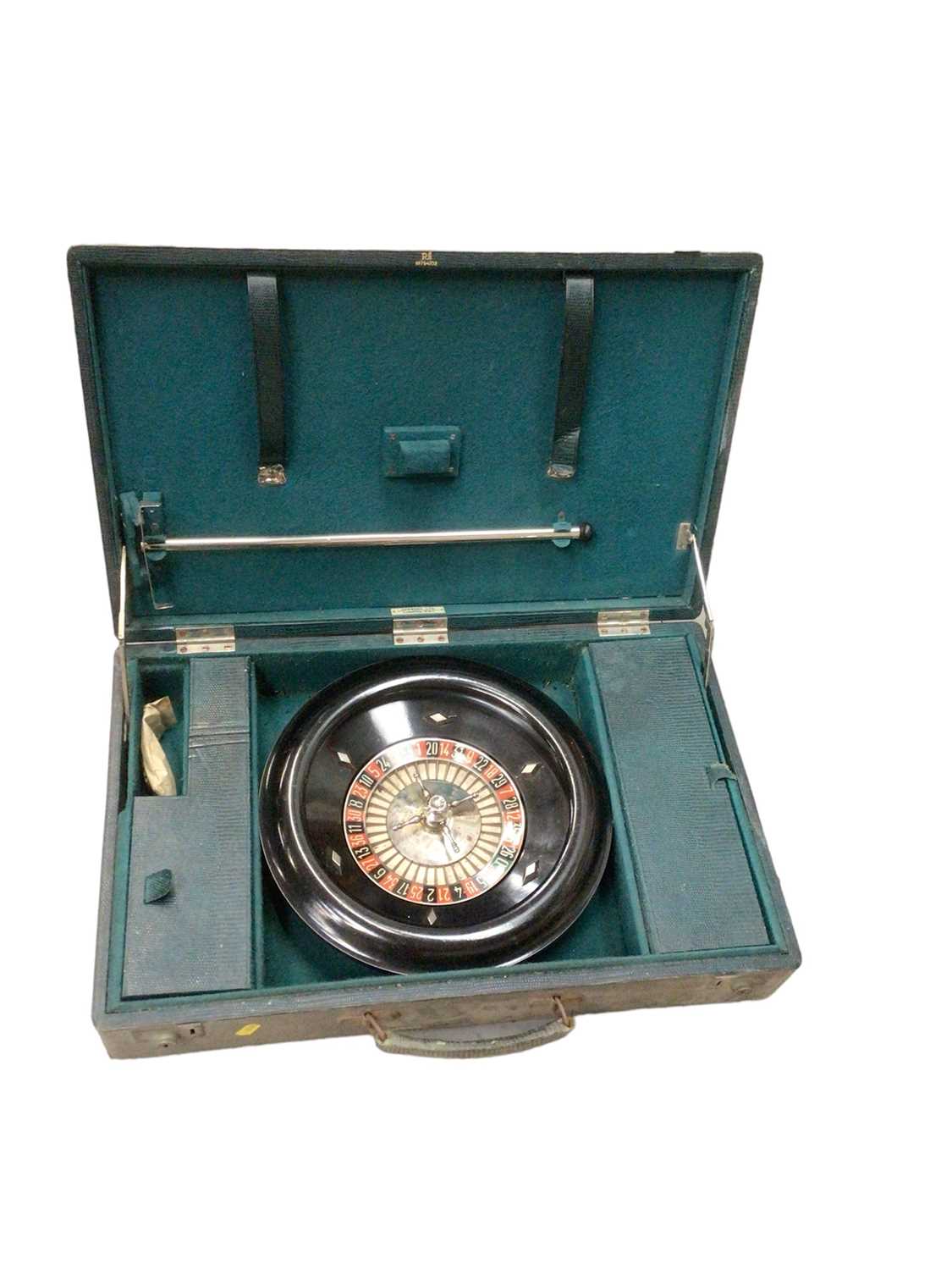 Vintage roulette wheel in leather case with counters and rake, retailed by Harrods