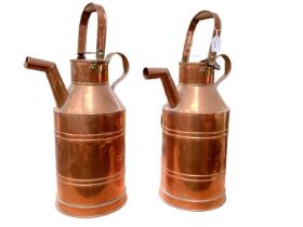 Two copper water carriers