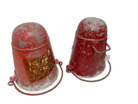 Two vintage red painted galvanised metal fire buckets with swing handles.