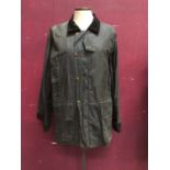 Women's navy wax jacket with tartan lining from the Formoy Collection made in Ireland size SX plus t