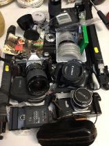 Three vintage Canon cameras, Tamron Adaptall 2 for Canon lense, tripod and accessories