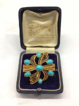Yellow metal (stamped 750) filigree brooch set with seven turquoise cabochons, 3.5cm